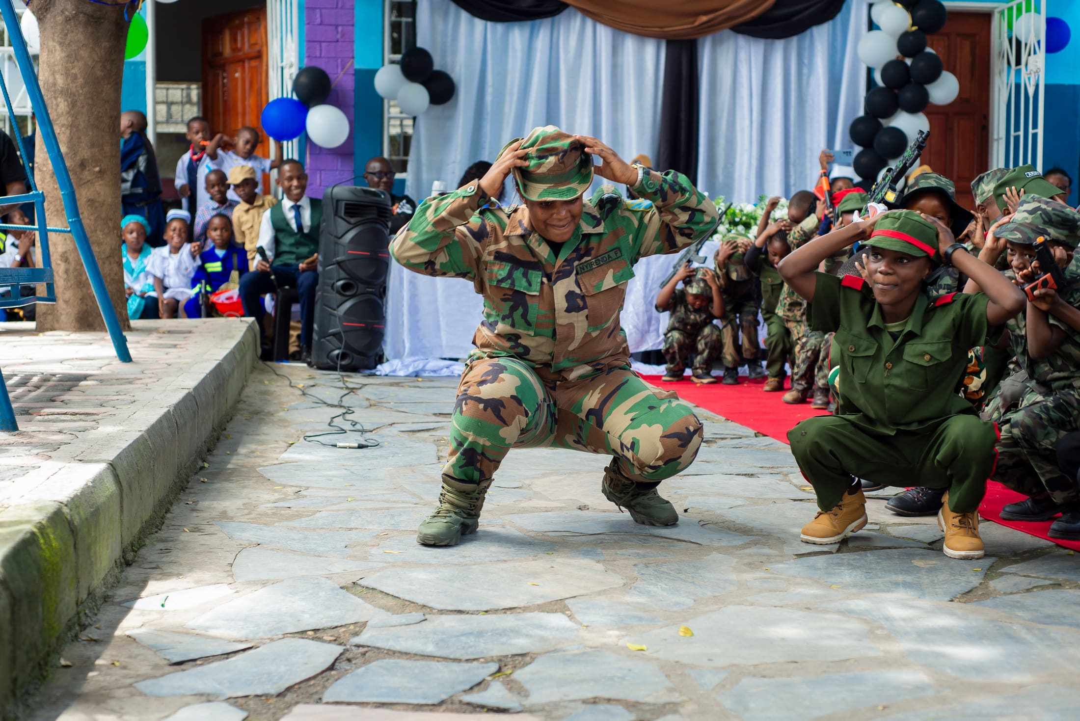 Tukiya pupils performing drills in uniform at Careers Day