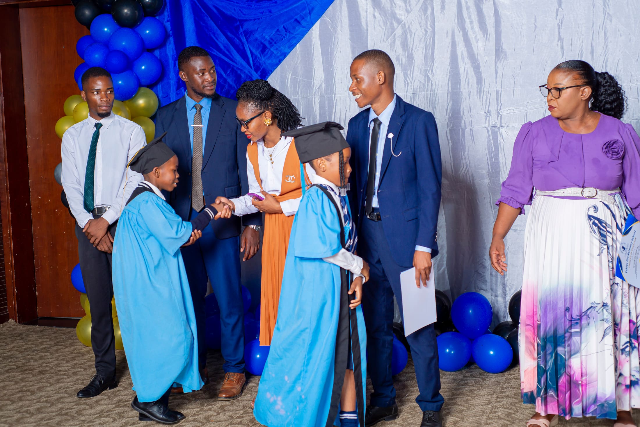 A group of graduates receiving their awards